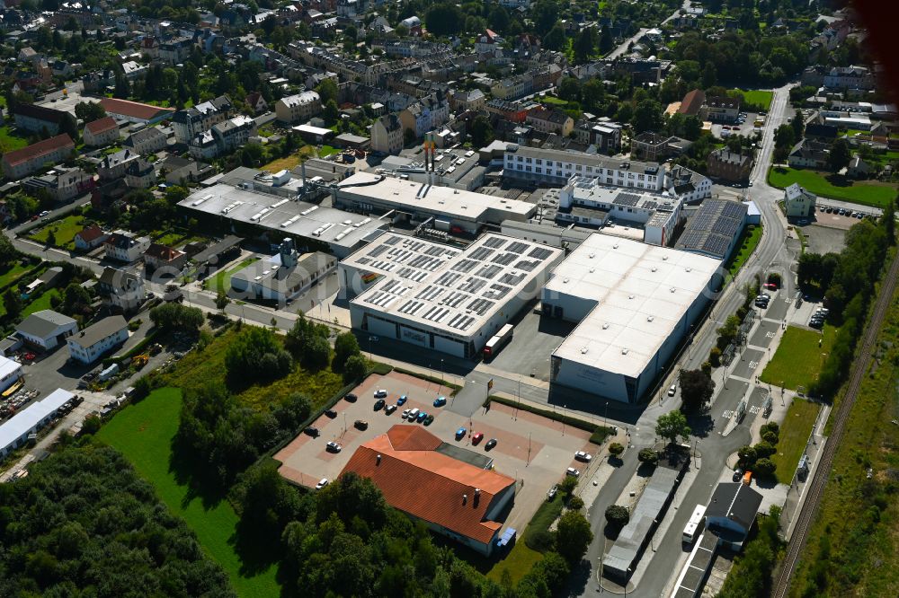 Treuen from the bird's eye view: Building and production halls on the premises of VOWALON Beschichtung GmbH on street Bahnhofstrasse - Ostrastrasse in Treuen in the state Saxony, Germany