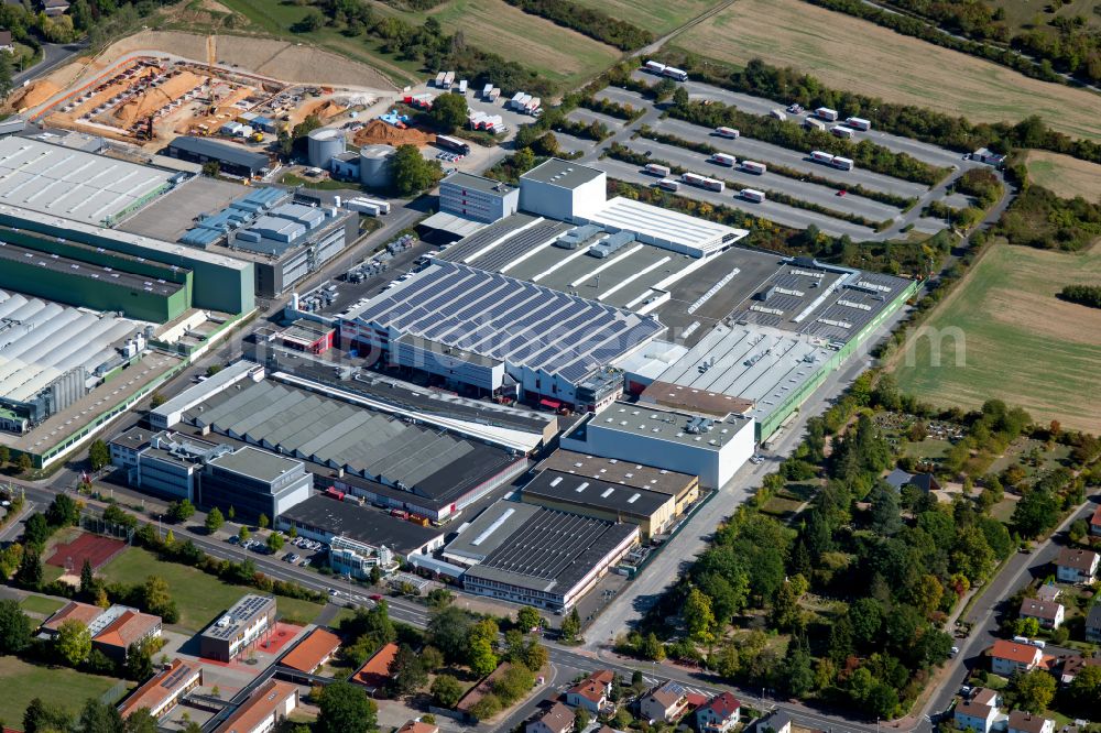 Aerial image Marktheidenfeld - Commercial area with the factory premises of WAREMA Renkhoff SE and the extension - new building - construction site on the buildings and production halls of the factory premises of Procter & Gamble Manufacturing GmbH Am Kornfeld - Baumhofstrasse in Marktheidenfeld in the state Bavaria, Germany