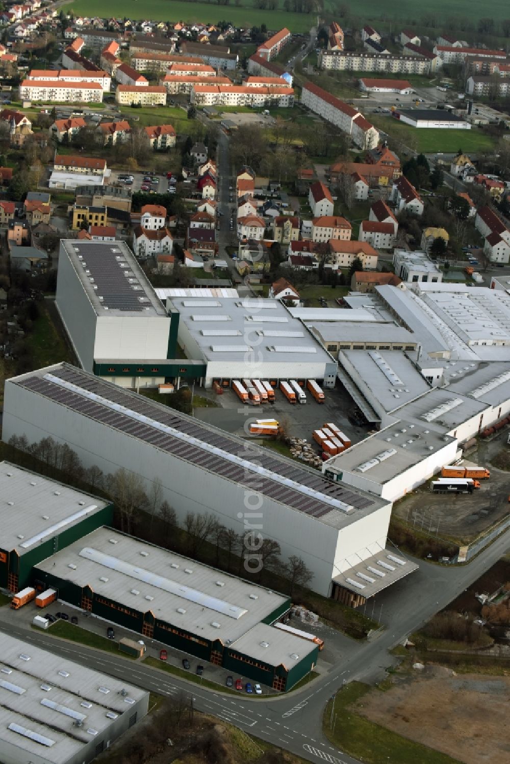 Lucka from the bird's eye view: Building and production halls on the premises of Wellpappenwerk Immobilien Lucka GmbH on Bahnhofstrasse in Lucka in the state Thuringia