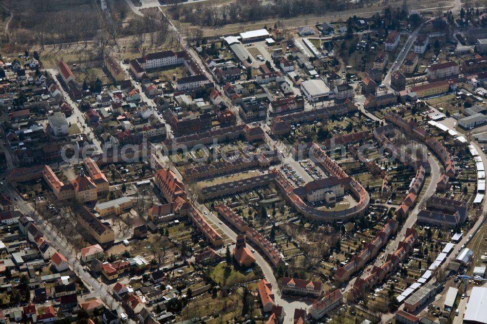 Wittenberg OT Piesteritz from the bird's eye view: The Piesteritzer employee housing is the largest car-free housing development in Germany. From 1916 to 1919, the garden city was built to plans by Paul Schmitthenner and Otto Rudolf Salvisberg for about 2000 employees of the adjacent nitrogen plant. It was recorded in 1986 in the list of monuments of the GDR and has since become a historical monument