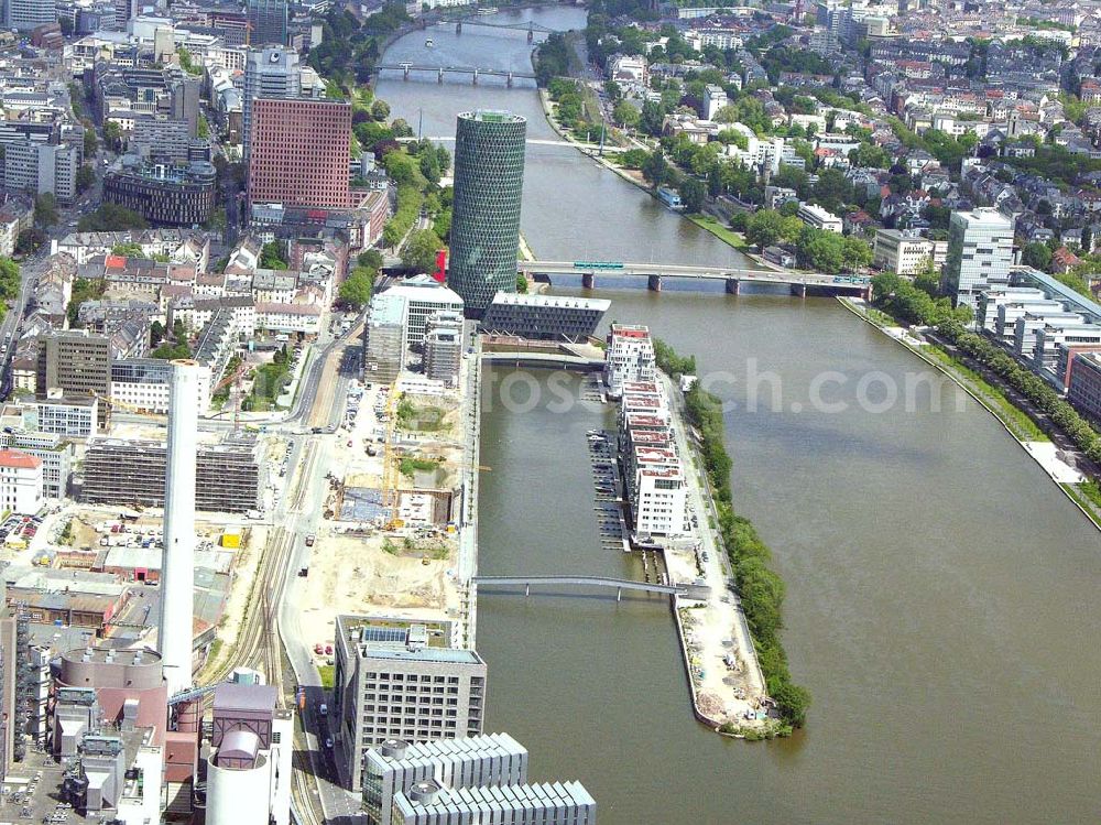 Frankfurt - Main / Hessen from the bird's eye view: Blick auf den Westhafen in Frankfurt/ Main. Im Vordergrund ist das Elektrizitätswerk und im Hintergrund ist der Westhafen Tower zu sehen. Das Elektrizitätswerk wird betrieben von der : Mainova AG, Solmsstraße 38, 60623 Frankfurt am Main Tel.: 069/ 213-02 Fax.: 069 /213-81122