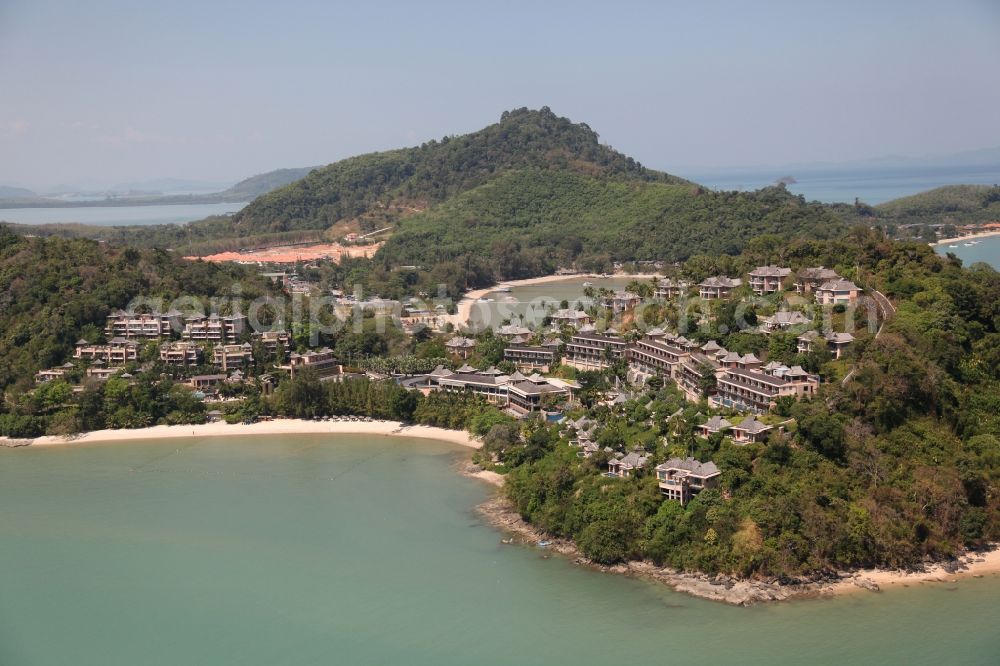 Ratsada from above - The Westin Hotel in Ratsada is located on the island of Phuket in Thailand on the beach and wooded hillsides between palms and overlooking the bay from Phuket Town