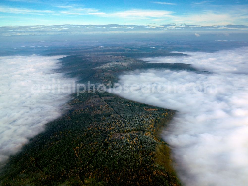 Mespelbrunn from the bird's eye view: Weather - landscape with mist - covered with clouds forest landscape in Bavaria Mespelbrunn