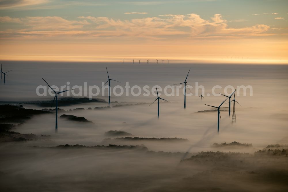 Aerial photograph Winsen (Luhe) - Weather-induced wind energy installations embedded in a fog layer at sunrise in Winsen (Luhe) in the state Lower Saxony, Germany