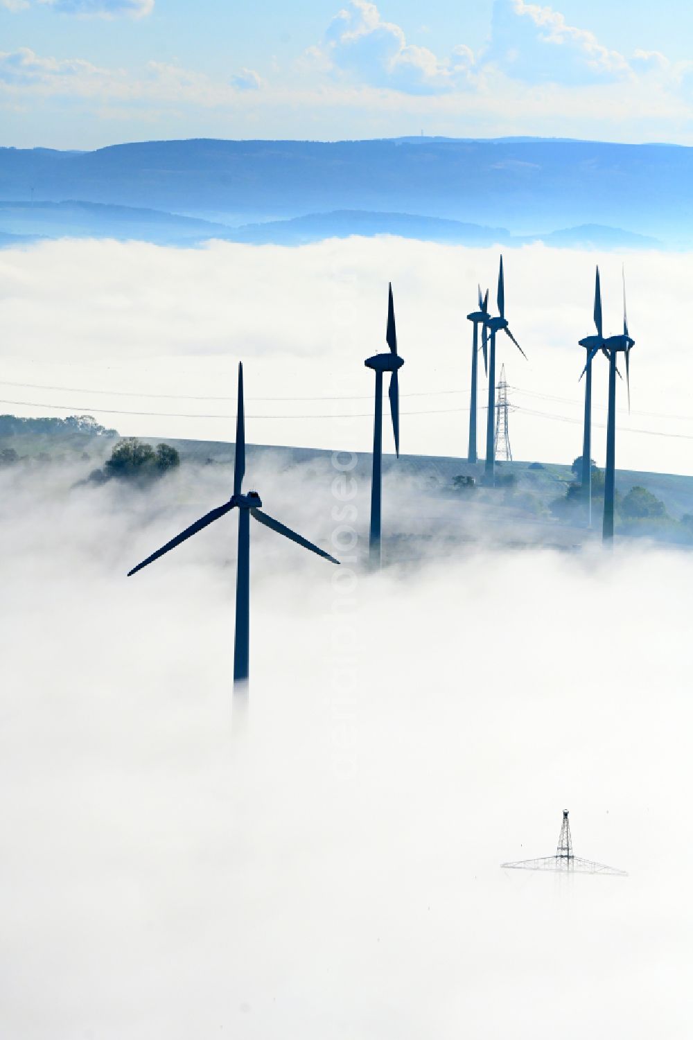 Einbeck from above - Weather-induced wind energy installations embedded in a fog layer in Einbeck in the state Lower Saxony, Germany