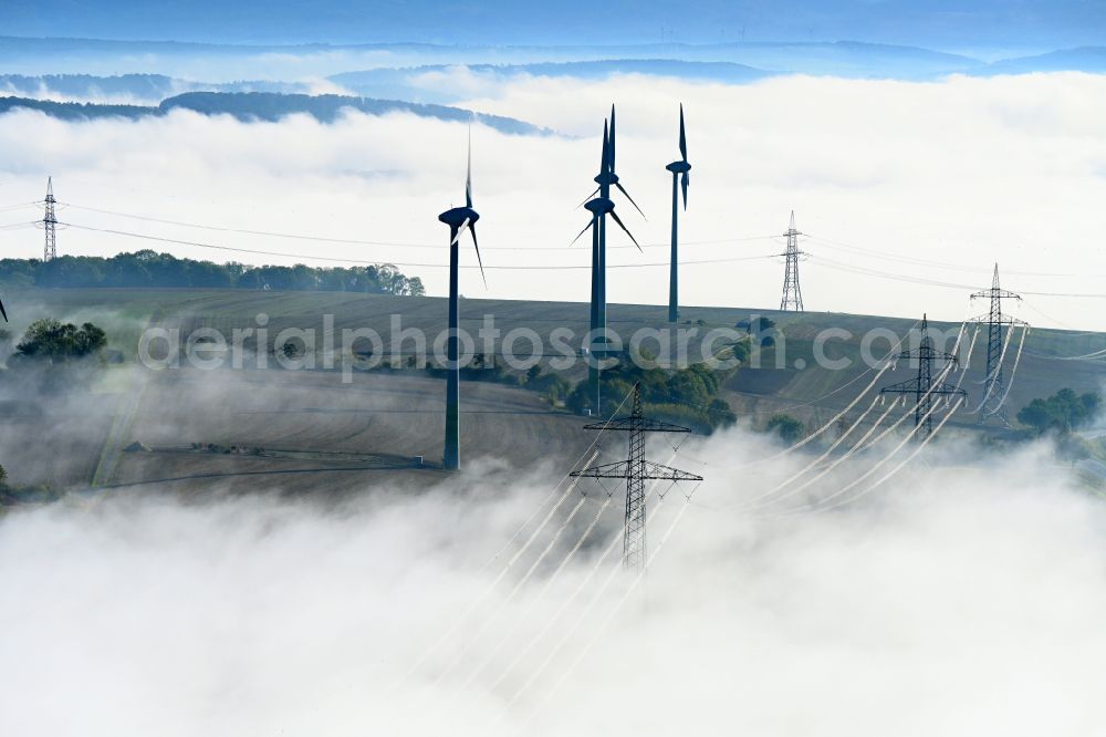 Aerial image Einbeck - Weather-induced wind energy installations embedded in a fog layer in Einbeck in the state Lower Saxony, Germany