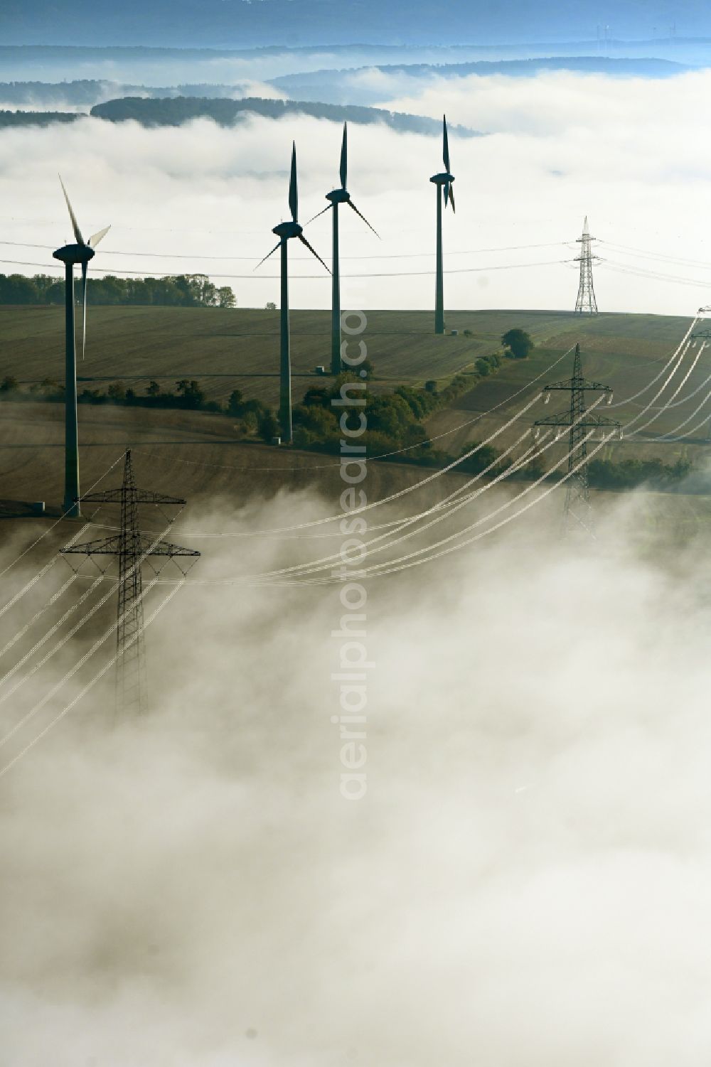 Einbeck from above - Weather-induced wind energy installations embedded in a fog layer in Einbeck in the state Lower Saxony, Germany