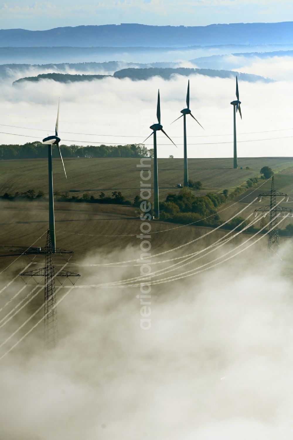 Einbeck from the bird's eye view: Weather-induced wind energy installations embedded in a fog layer in Einbeck in the state Lower Saxony, Germany