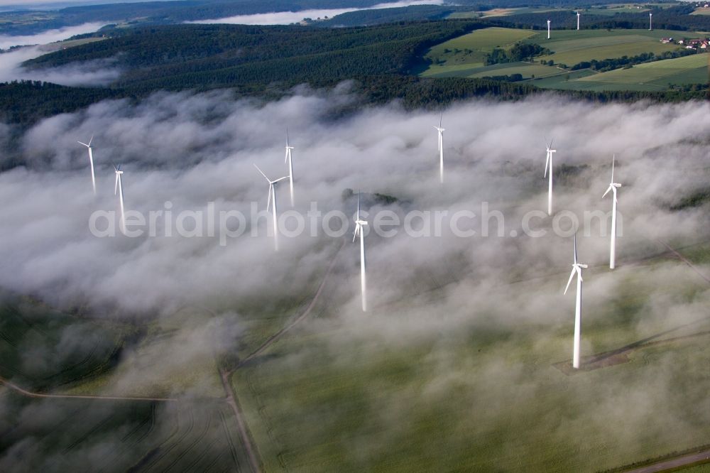 Aerial photograph Höxter - Weather-induced wind energy installations embedded in a fog layer on a field in the district Fuerstenau in Hoexter in the state North Rhine-Westphalia