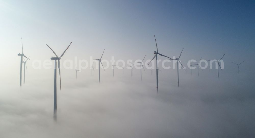 Jacobsdorf from the bird's eye view: Weather-induced wind energy installations embedded in a fog layer in Jacobsdorf in the state Brandenburg, Germany