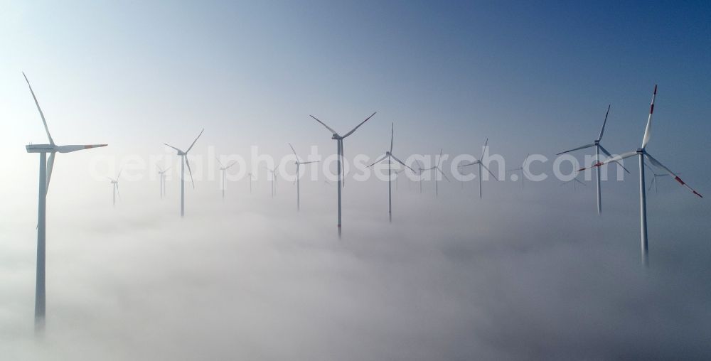 Jacobsdorf from the bird's eye view: Weather-induced wind energy installations embedded in a fog layer in Jacobsdorf in the state Brandenburg, Germany