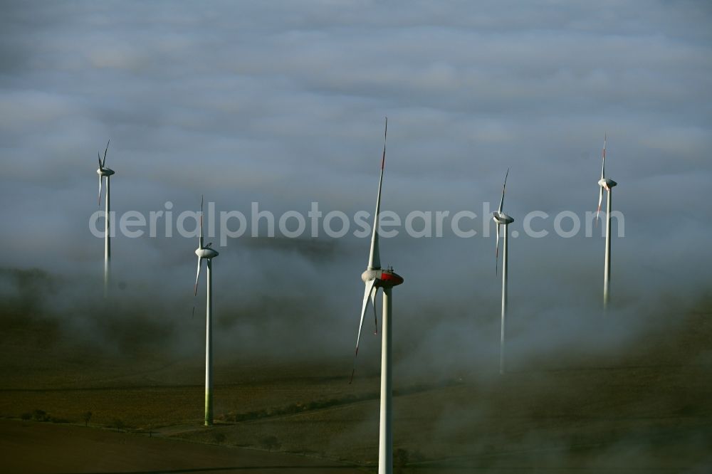 Reinsdorf from above - Weather-induced wind energy installations embedded in a fog layer in Reinsdorf in the state Thuringia, Germany