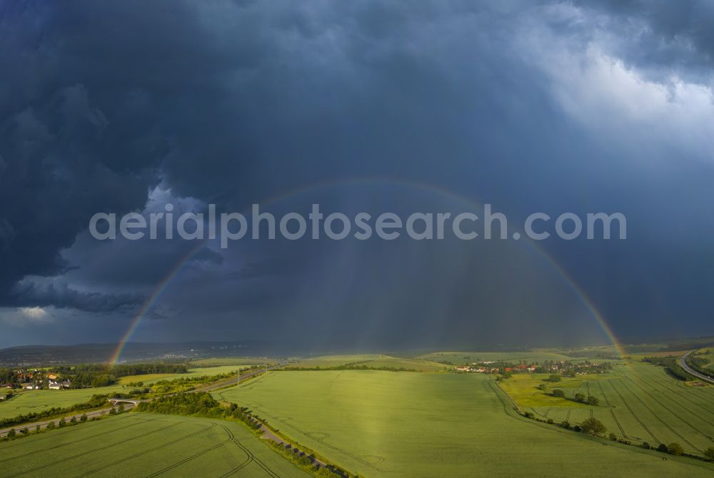 Aerial image Krebs - Haze and precipitation conditions with rainbow formation on a field on street Krebs in Krebs in the state Saxony, Germany