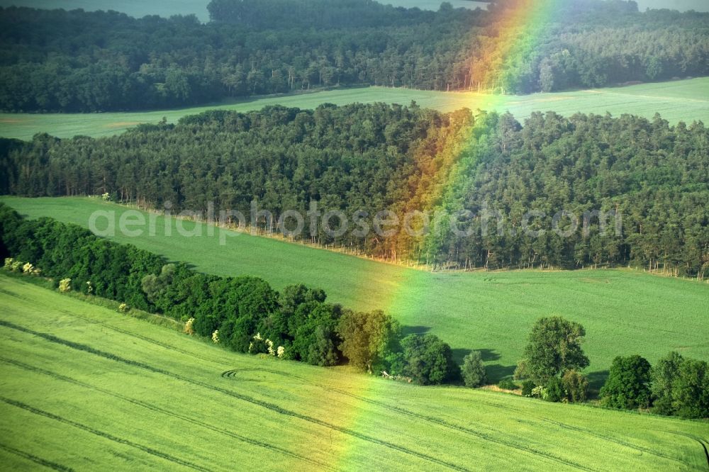 Fehrbellin from the bird's eye view: Haze and precipitation conditions with rainbow formation in Fehrbellin in the state Brandenburg