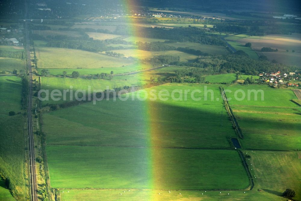 Nauen from the bird's eye view: Haze and precipitation conditions with rainbow formation in Nauen in the state Brandenburg