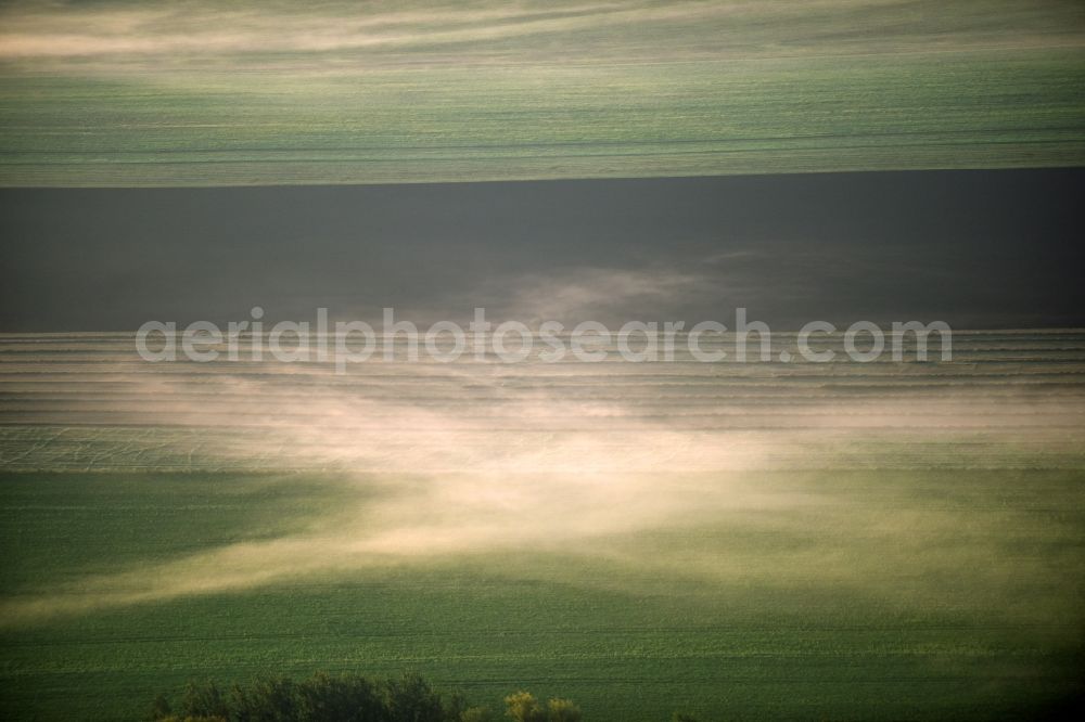 Aerial image Rathmannsdorf - Weather with layered fog cover on a field landscape in Rathmannsdorf in the state Saxony-Anhalt, Germany