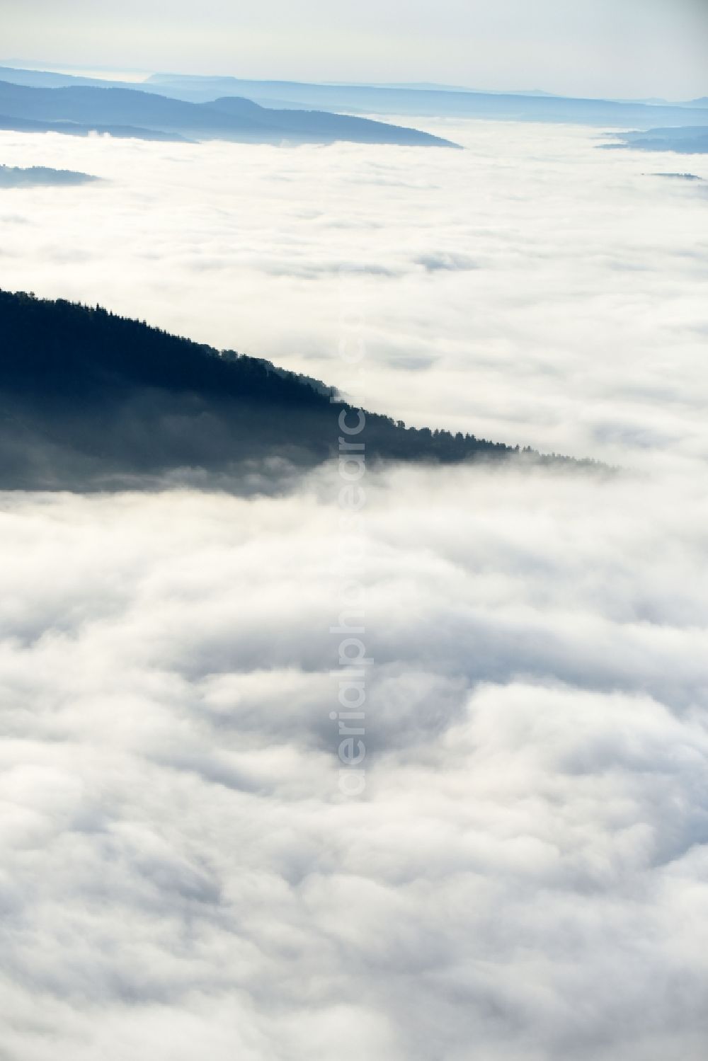 Malsfeld from the bird's eye view: Weather with layered fog cover in Malsfeld in the state Hesse, Germany