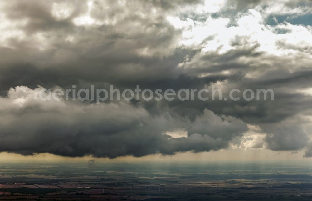 Ahrenshagen-Daskow from the bird's eye view: Weather situation with solar radiation from openings of the cloud cover in the district Ahrenshagen in Ahrenshagen-Daskow in the state Mecklenburg - Western Pomerania