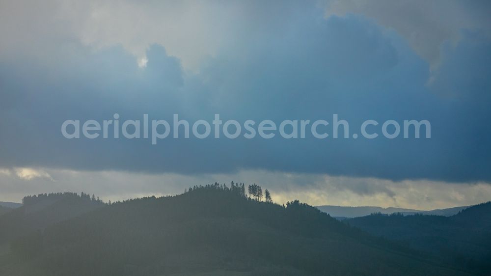 Eslohe (Sauerland) from above - Weather situation with solar radiation from openings of the cloud cover in the district Oesterberge in Eslohe (Sauerland) in the state North Rhine-Westphalia, Germany