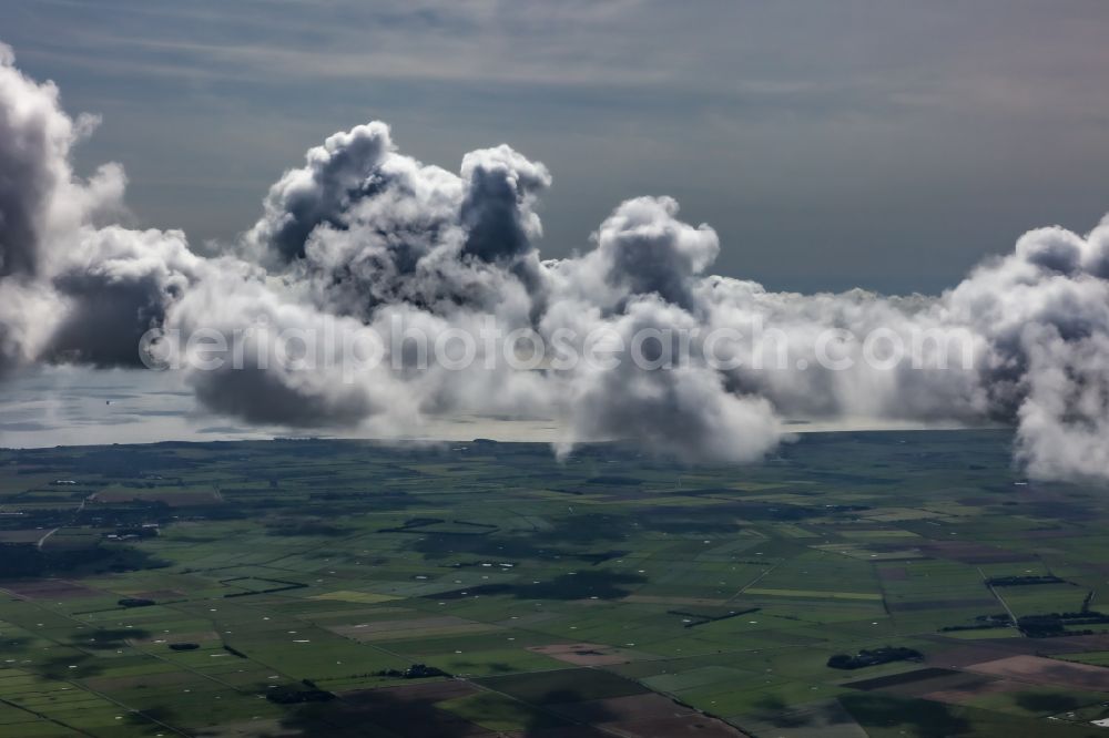 Aerial photograph Midlum - Weather conditions with cloud formation ueber landwirtschaftlichen Flaechen of Insel Foehr in Midlum North Friesland in the state Schleswig-Holstein, Germany