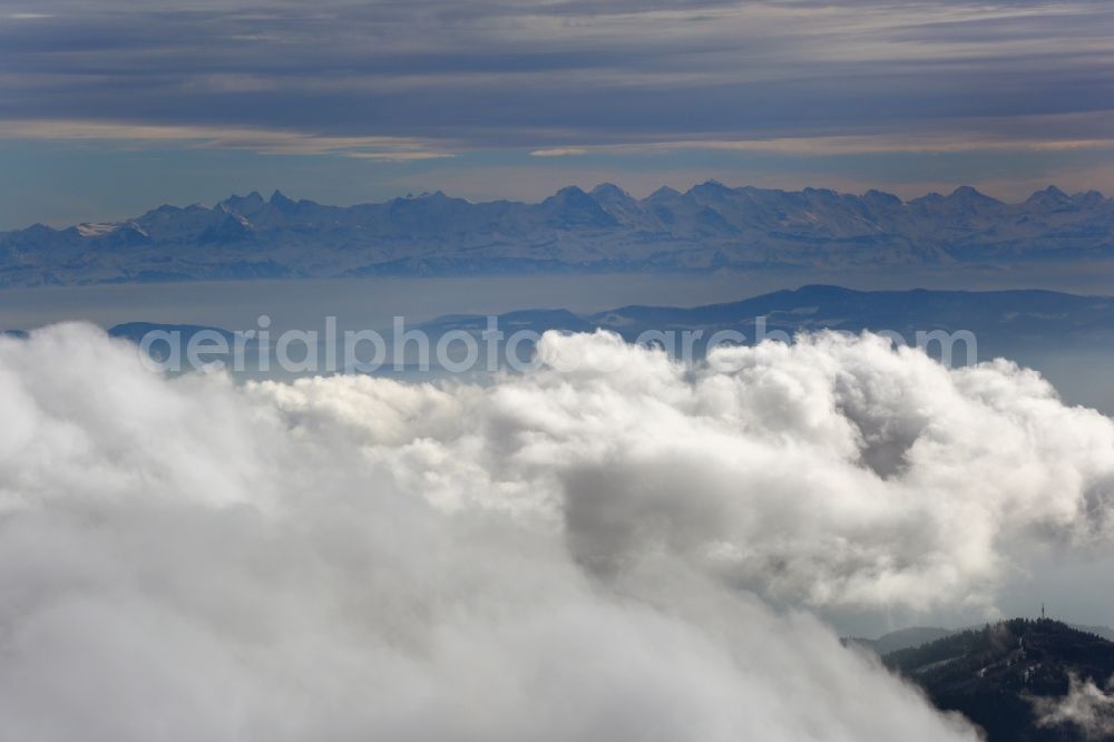 Aerial photograph Müllheim - Weather with cloud formation over the Black Forest in Baden - Wuerttemberg. Snow-covered Black Forest mountains and panoramic view over the cloud cover up to the Swiss Alps