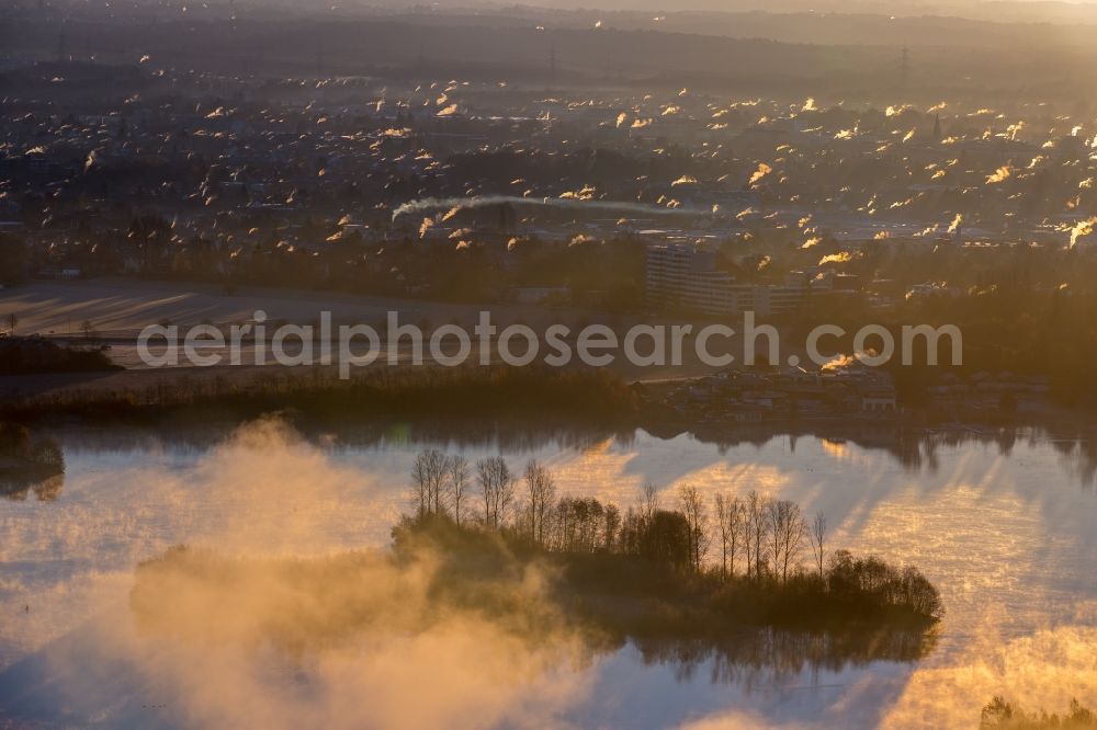 Hilden from the bird's eye view: Weather situation with cloud formation and light reflections at sunrise over the Elbsee in the district Stadtbezirk 8 in Hilden in the state North Rhine-Westphalia