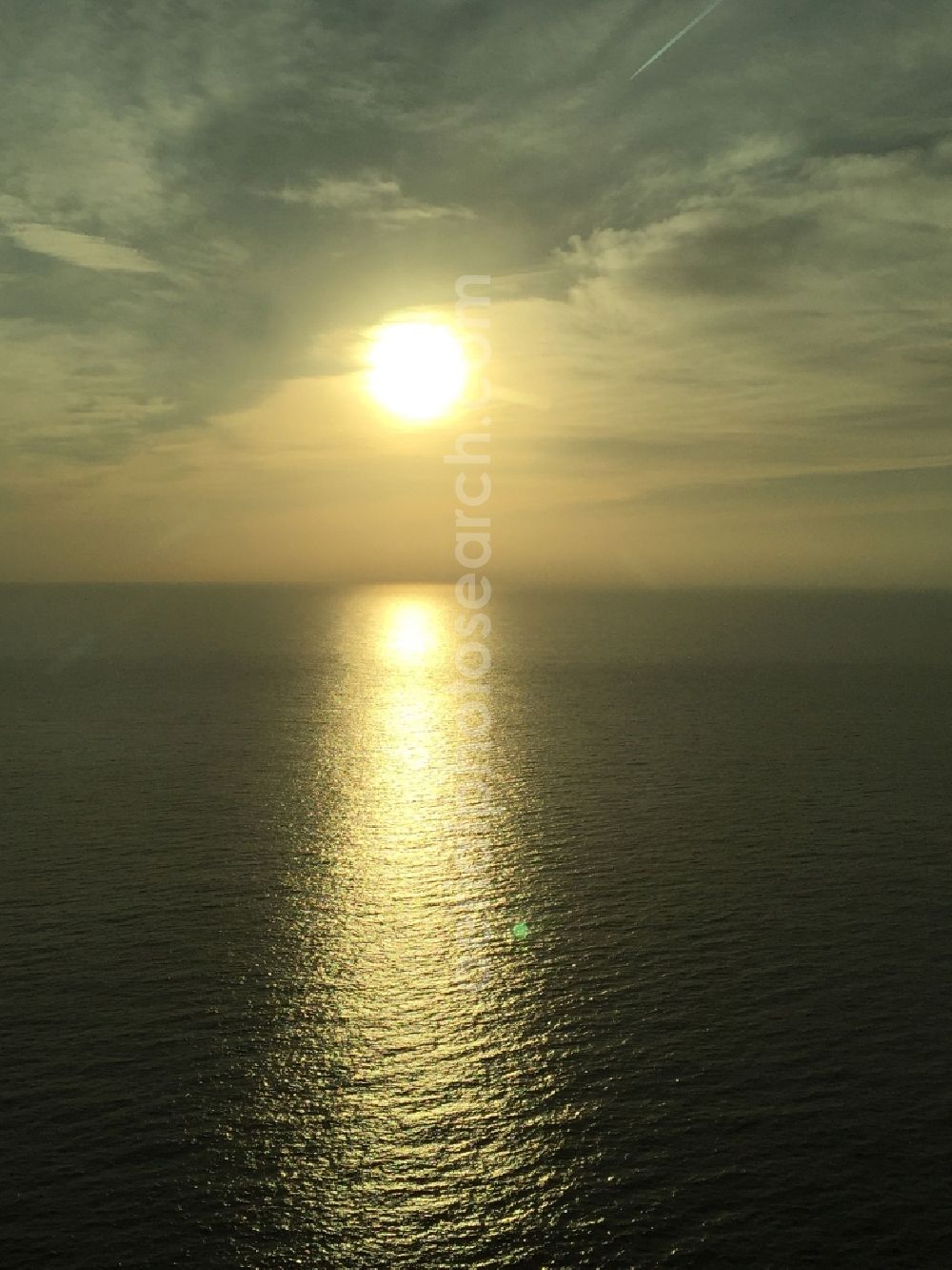 Saint-Jean-Cap-Ferrat from above - Weather situation with cloud formation and light reflections at sunrise over the Mediterranean Sea in Saint-Jean-Cap-Ferrat in Provence-Alpes-Cote d'Azur, France