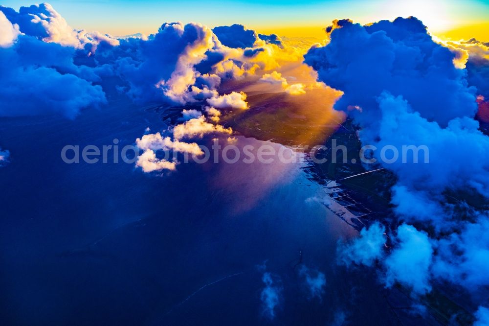 Sankt Peter-Ording from above - Weather situation with cloud formation and light reflections at sunset in Sankt Peter-Ording in the state Schleswig-Holstein, Germany