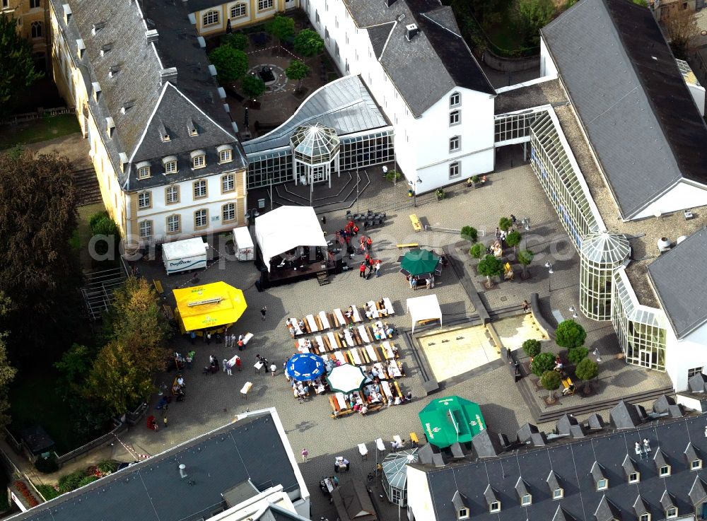 Vallendar from above - WHU Otto Beisheim School of Management in Vallendar in the state of Rhineland-Palatinate. The Wolfgang Gerbere college is located on Burgplatz square in the town centre and consists of a building complex of historic and modern architectural elements. An event with food and stands is taking place on the square