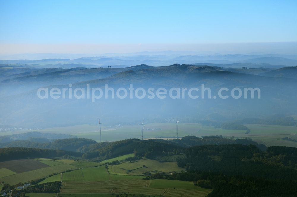 Eslohe from above - High fog-like cloud layers imposed by the source view of a wind turbine for electricity generation in Eslohe in North Rhine-Westphalia