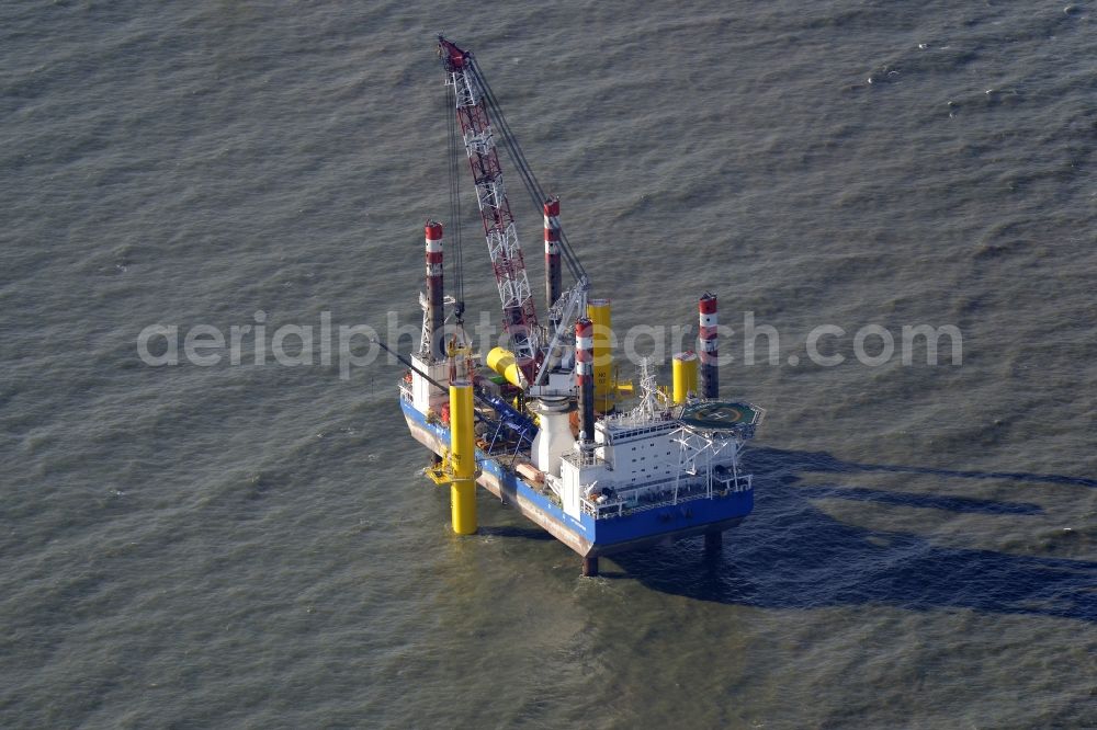 Aerial image Wangerland - Windenergieanlagen (WEA) under construction in the North Sea Aussenweser near Wangerland. MPI Enterprise special vessel for the construction of offshore wind energy turbines (WTD)