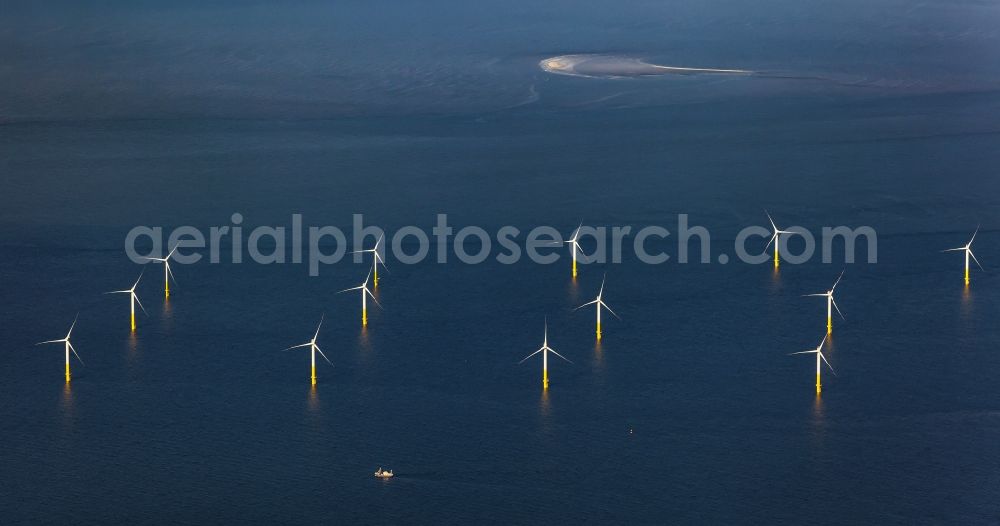 Nordergründe from above - Wind turbines of the offshore wind farm on the water surface of North Sea in Nordergruende in the state Lower Saxony, Germany