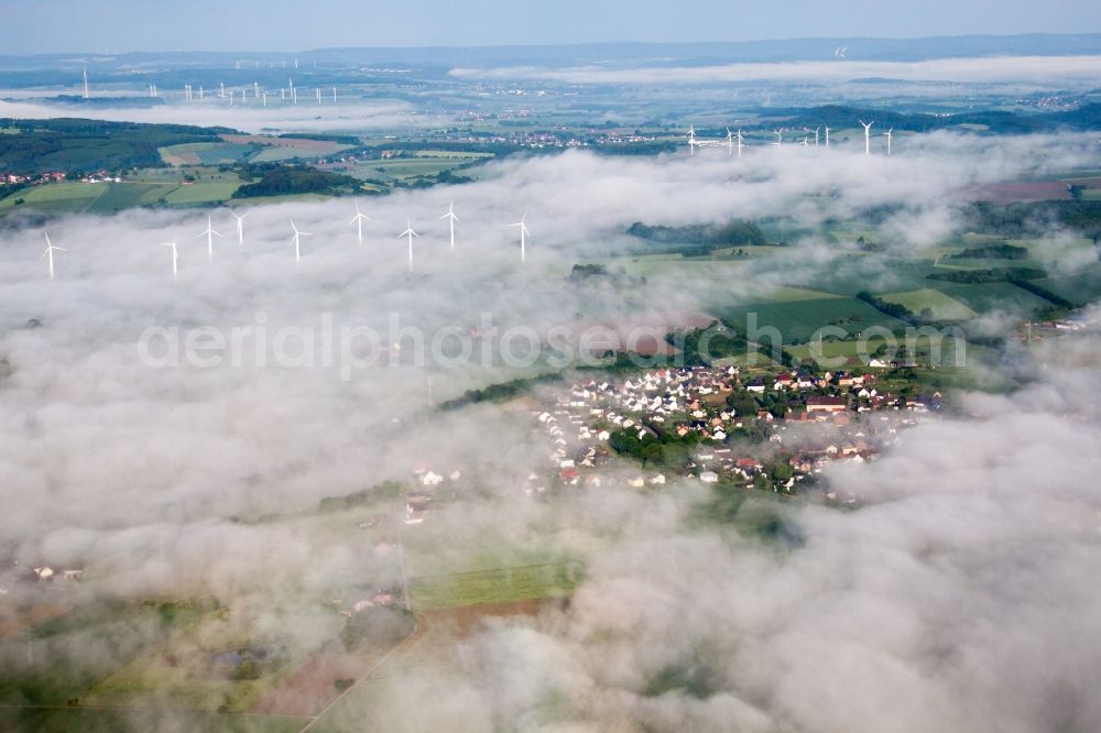 Höxter from the bird's eye view: Wind turbine windmills in morning mist on a field in the district Fuerstenau in Hoexter in the state North Rhine-Westphalia