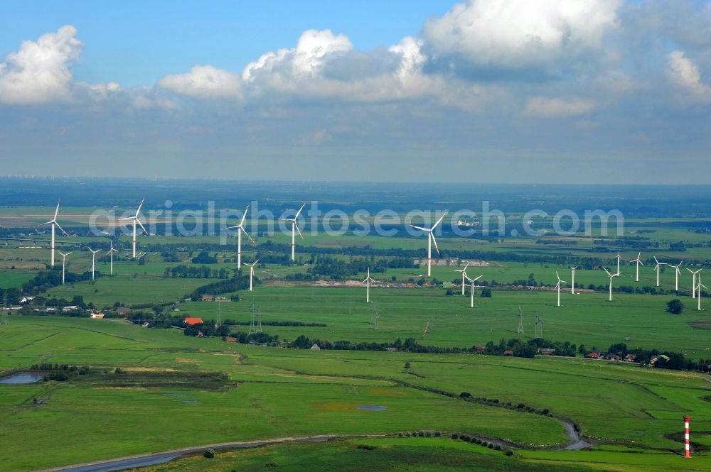 Aerial photograph Brunsbüttel - Wind turbine windmills on a field in Brunsbuettel in the state Schleswig-Holstein