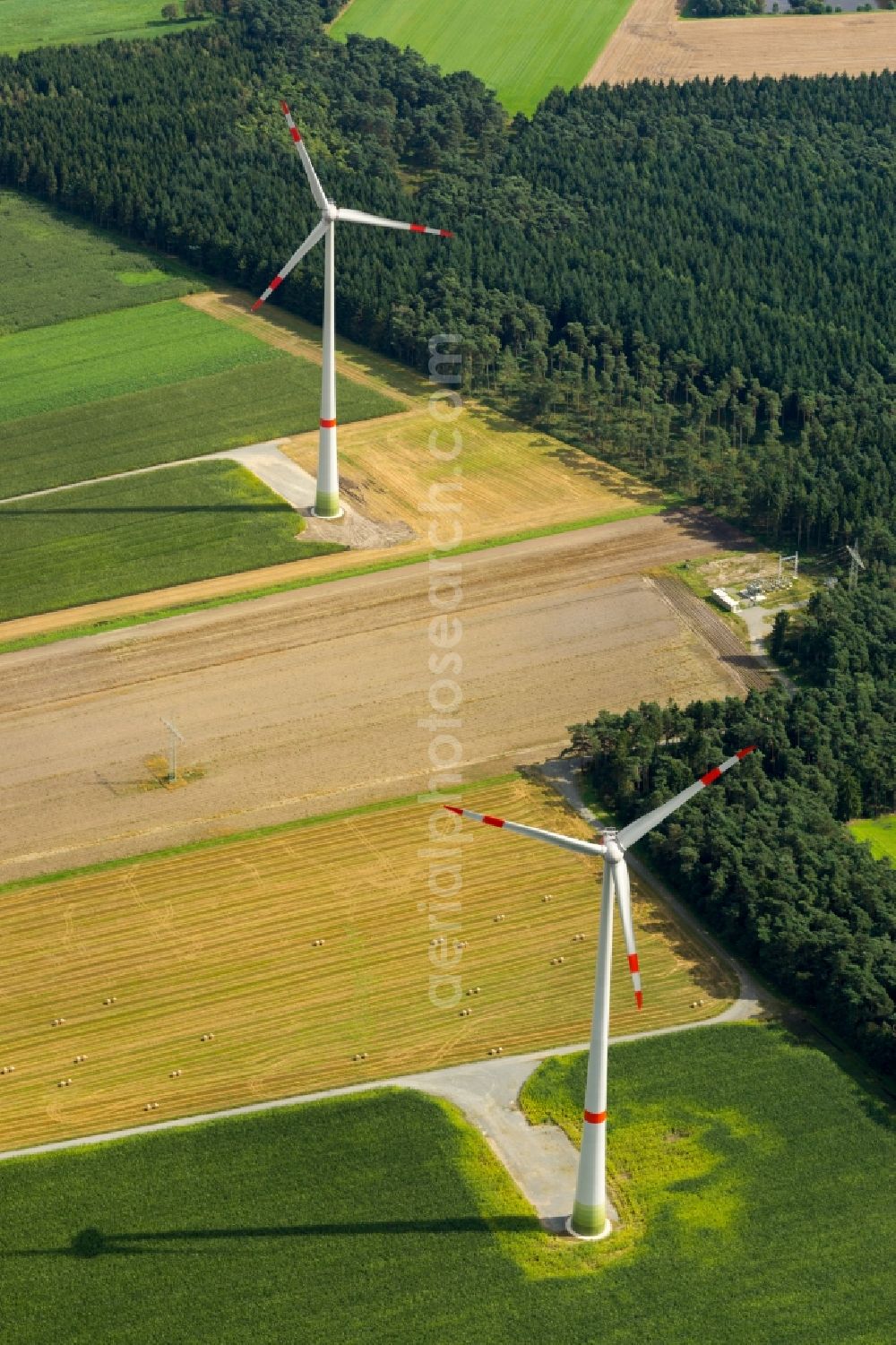 Deinste from above - Wind turbine windmills on a field in Deinste in the state Lower Saxony, Germany