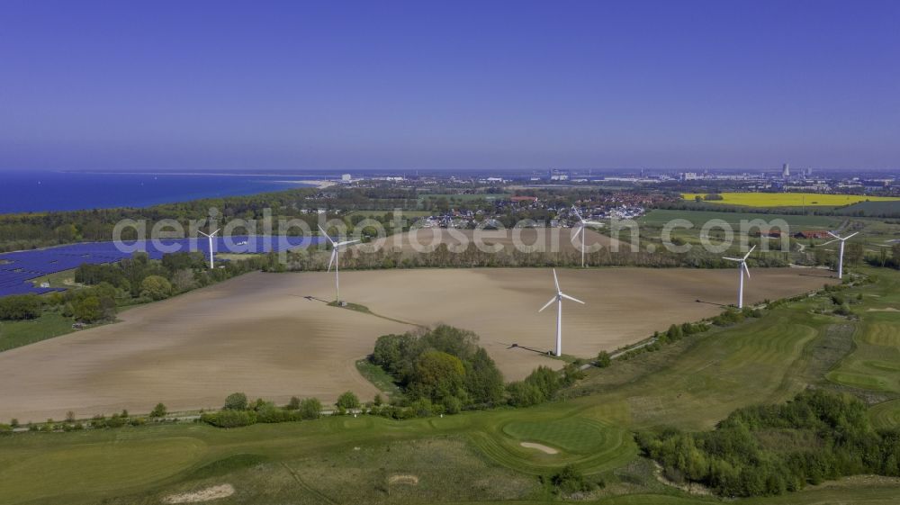 Diedrichshagen from the bird's eye view: Wind turbine windmills on a field in Diedrichshagen in the state Mecklenburg - Western Pomerania, Germany