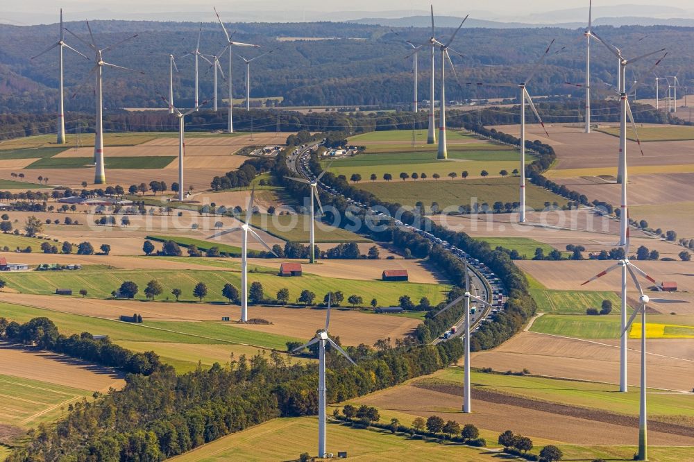 Bad Wünnenberg from the bird's eye view: Wind turbine windmills on a field along the BAB A44 in Bad Wuennenberg in the state North Rhine-Westphalia, Germany