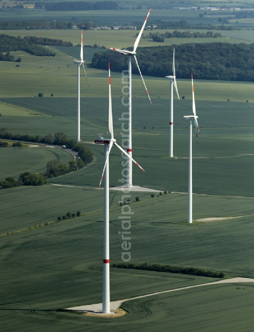 Kirchheilingen from the bird's eye view: Wind turbine windmills on a field in Kirchheilingen in the state Thuringia, Germany