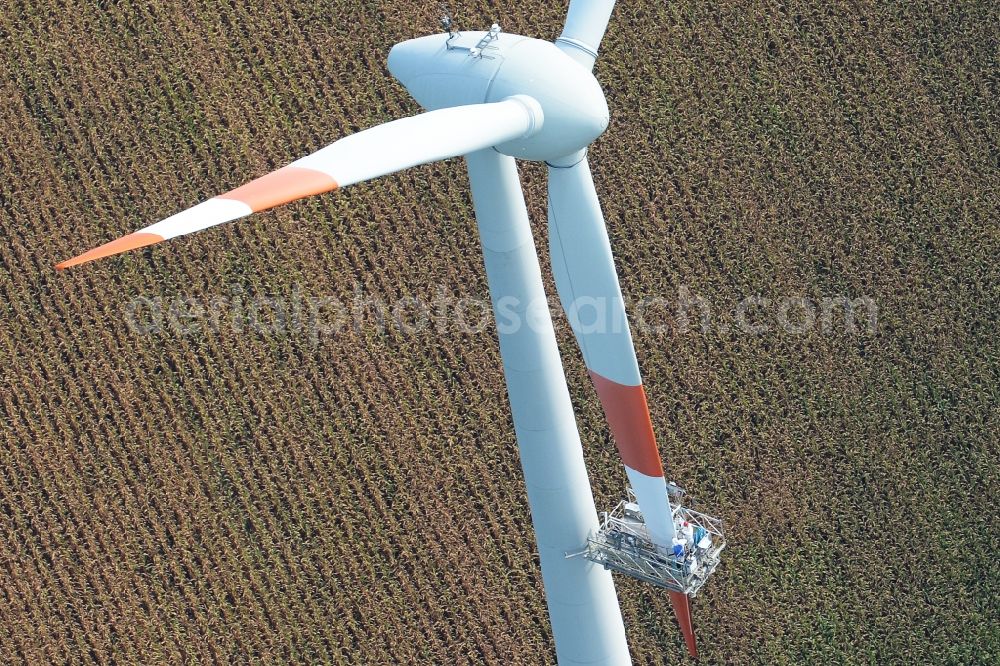 Aerial image Kutenholz - Repair work of a wind turbine windmill on a field in Kutenholz in the state Lower Saxony