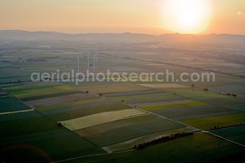 Minfeld from the bird's eye view: Wind turbine windmills on a field in Minfeld in the state Rhineland-Palatinate