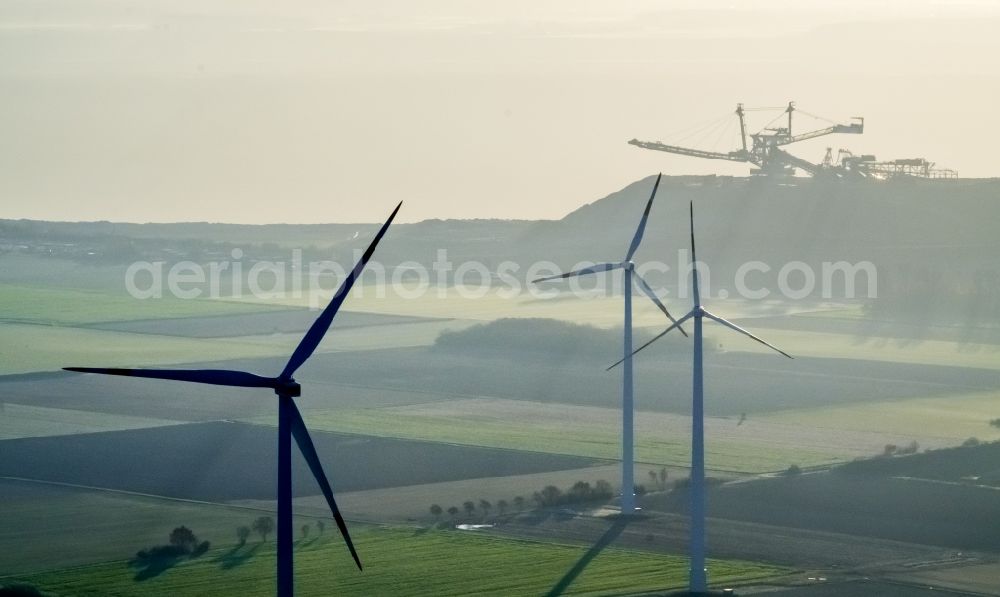 Aerial image Titz - Wind turbine windmills on a field in the district Bettenhoven in Titz in the state North Rhine-Westphalia. In the background, the brown coal mine opencast mine Hambach - Etzweiler of RWE Power AG