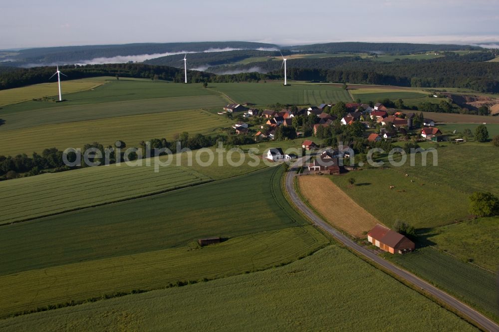 Marienmünster from the bird's eye view: Wind turbine windmills on a field in the district Bremerberg in Marienmuenster in the state North Rhine-Westphalia