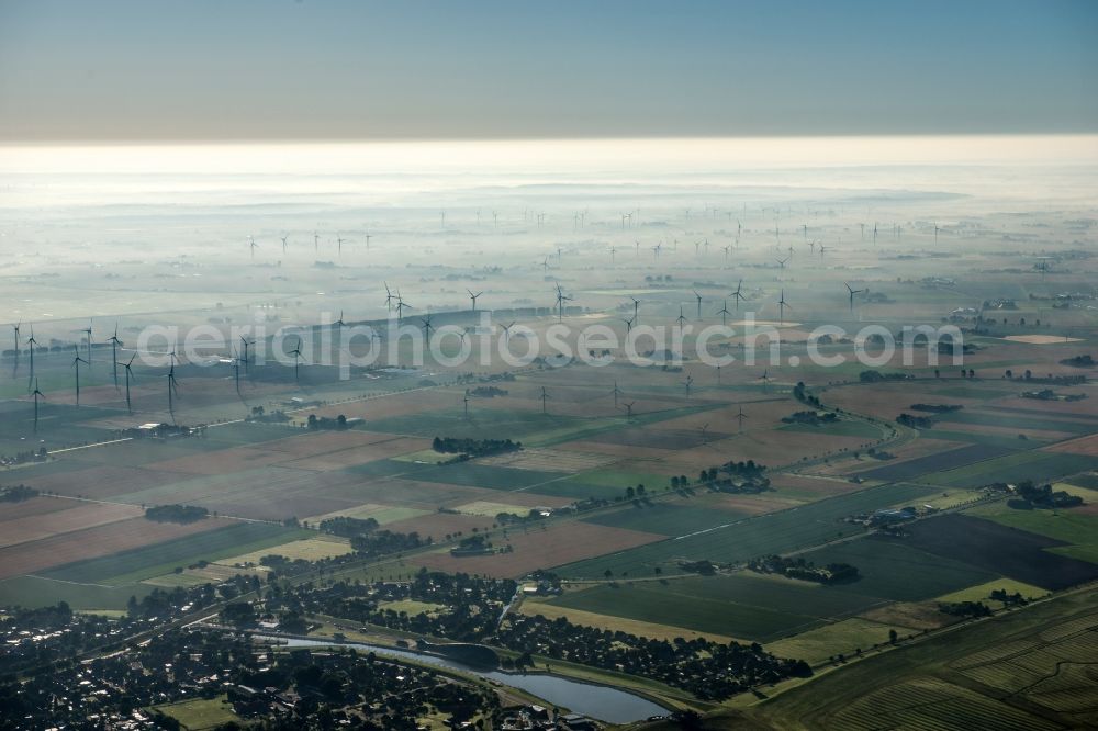 Friedrichskoog from the bird's eye view: Wind turbine windmills on a field in the district Hamburg Metropolitan Area in Friedrichskoog in the state Schleswig-Holstein