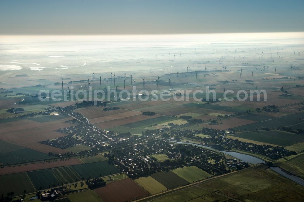 Aerial image Friedrichskoog - Wind turbine windmills on a field in the district Hamburg Metropolitan Area in Friedrichskoog in the state Schleswig-Holstein