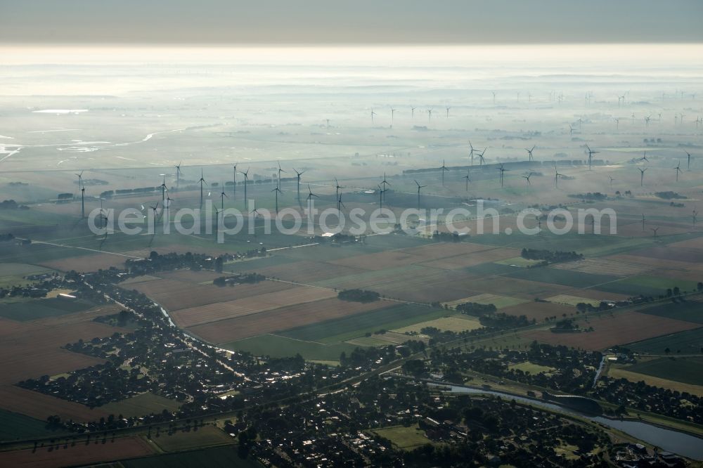 Aerial photograph Friedrichskoog - Wind turbine windmills on a field in the district Hamburg Metropolitan Area in Friedrichskoog in the state Schleswig-Holstein