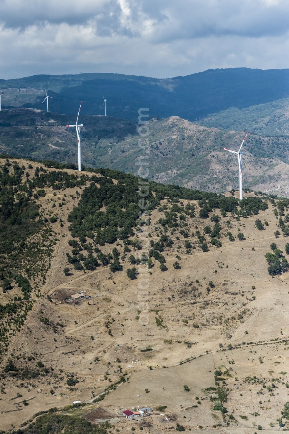 Sizilien from the bird's eye view: Wind turbine windmills on a field in Sizilien in Italy