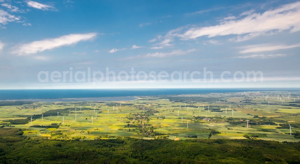 Szczeglino from the bird's eye view: Wind turbine windmills on a field in Szczeglino in West Pomerania, Poland