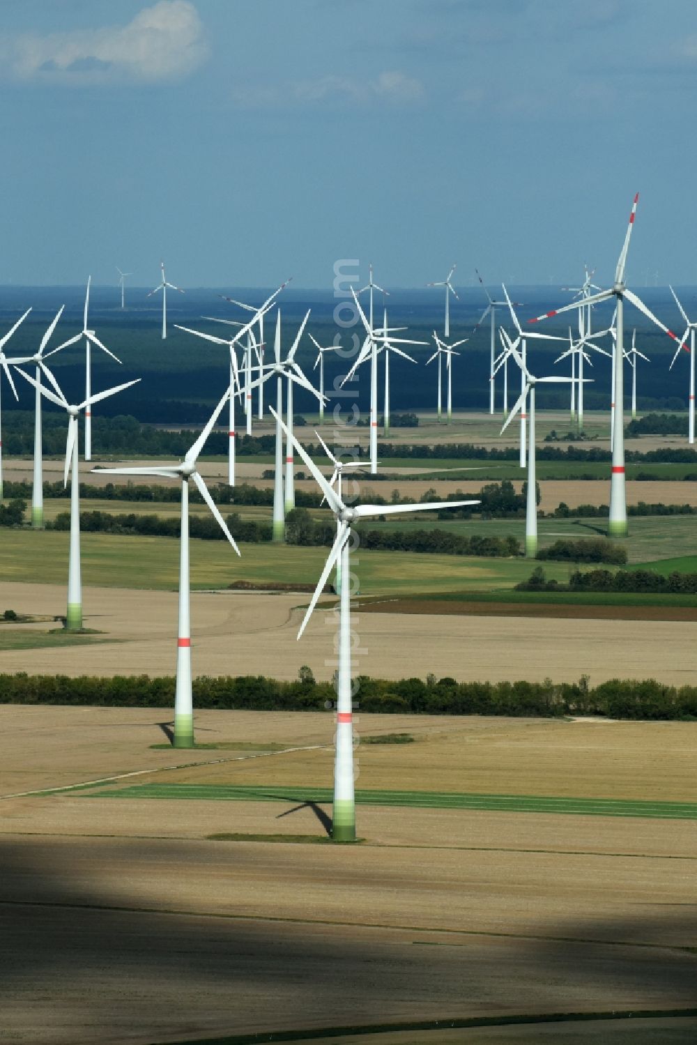 Treuenbrietzen from the bird's eye view: Wind turbine windmills on a field in Treuenbrietzen in the state Brandenburg