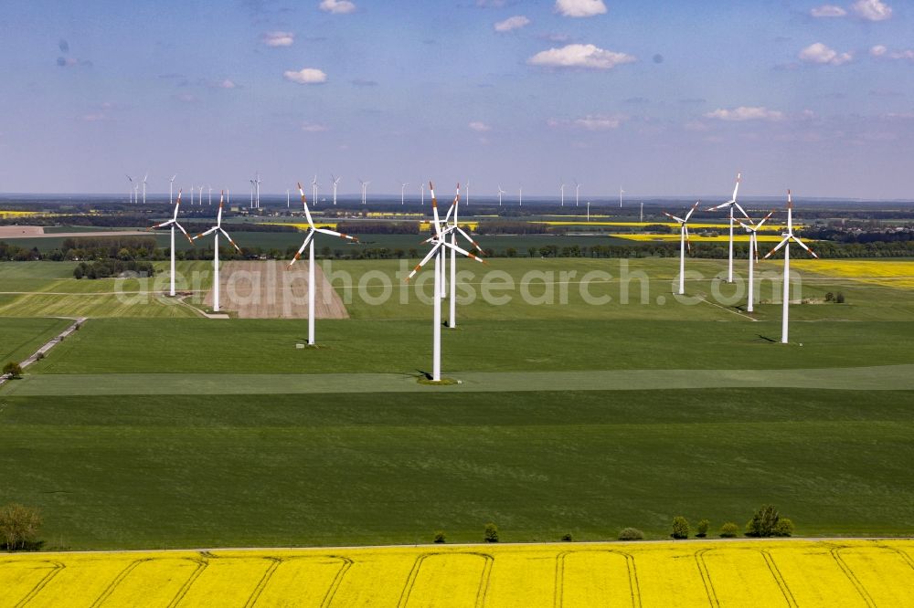 Werneuchen from the bird's eye view: Wind turbine windmills on a field in Werneuchen in the state Brandenburg