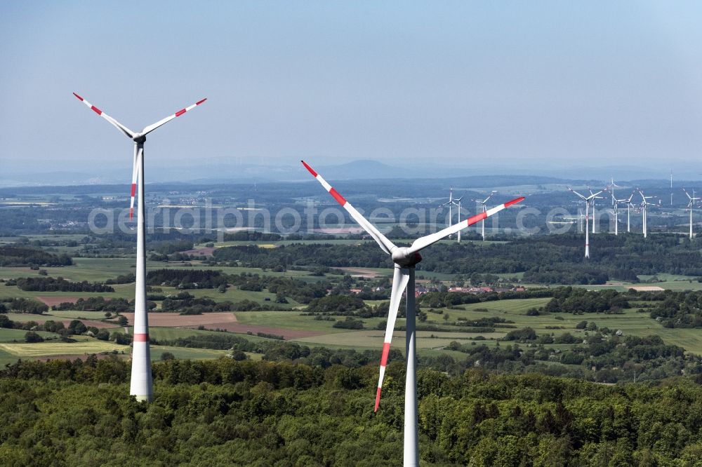 Feldatal from the bird's eye view: Wind turbine windmills (WEA) in a forest area in Feldatal in the state Hesse, Germany